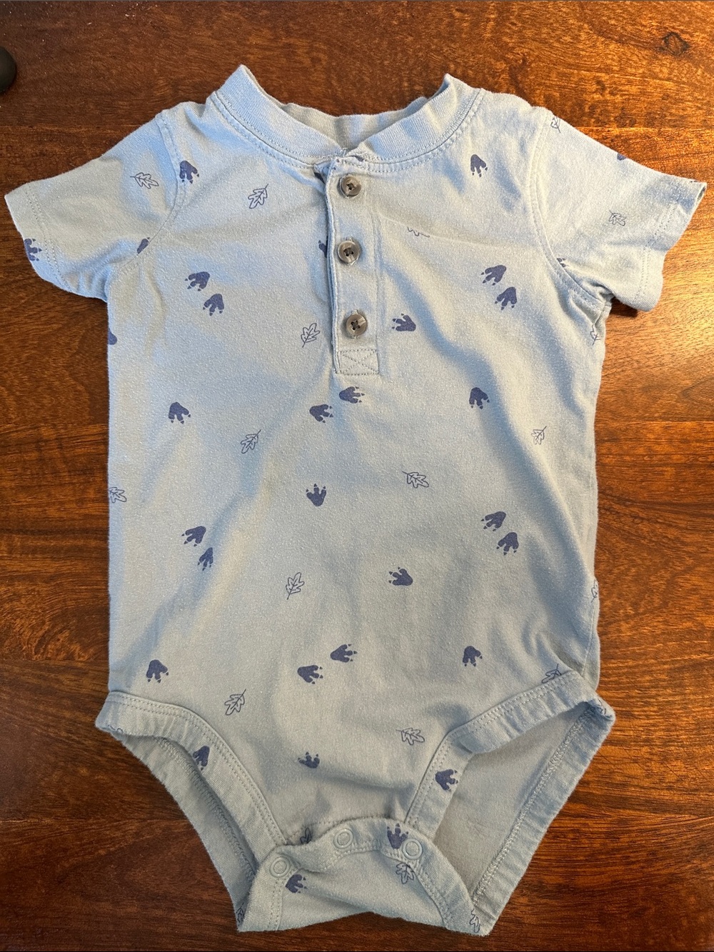 Carter’s Light Blue Baby Henley Onesie with Navy Dinosaur Foot and Leaf Print